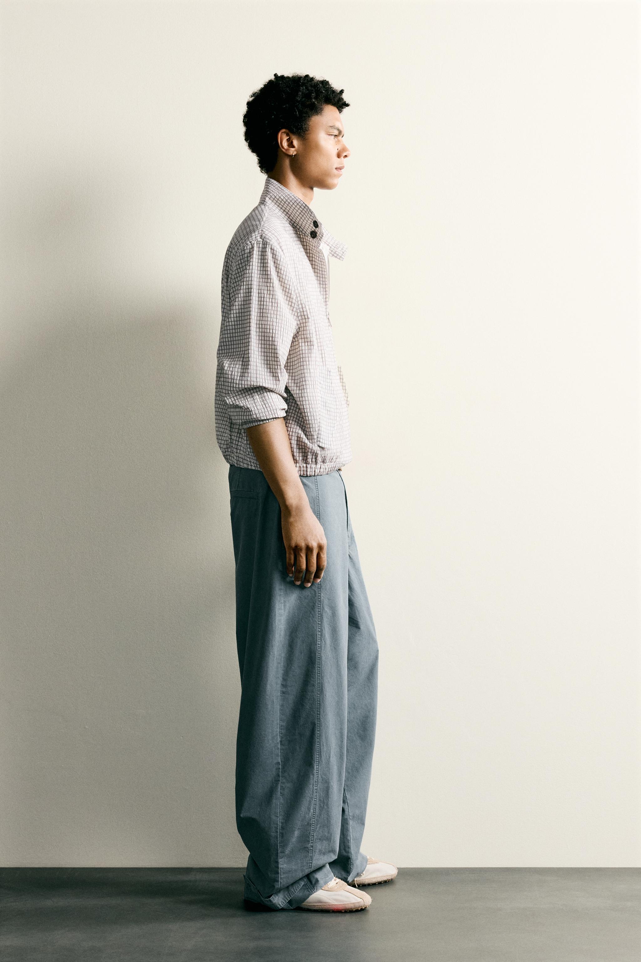 PANTALON DÉLAVÉ COUPE DÉCONTRACTÉE AVEC PATTES